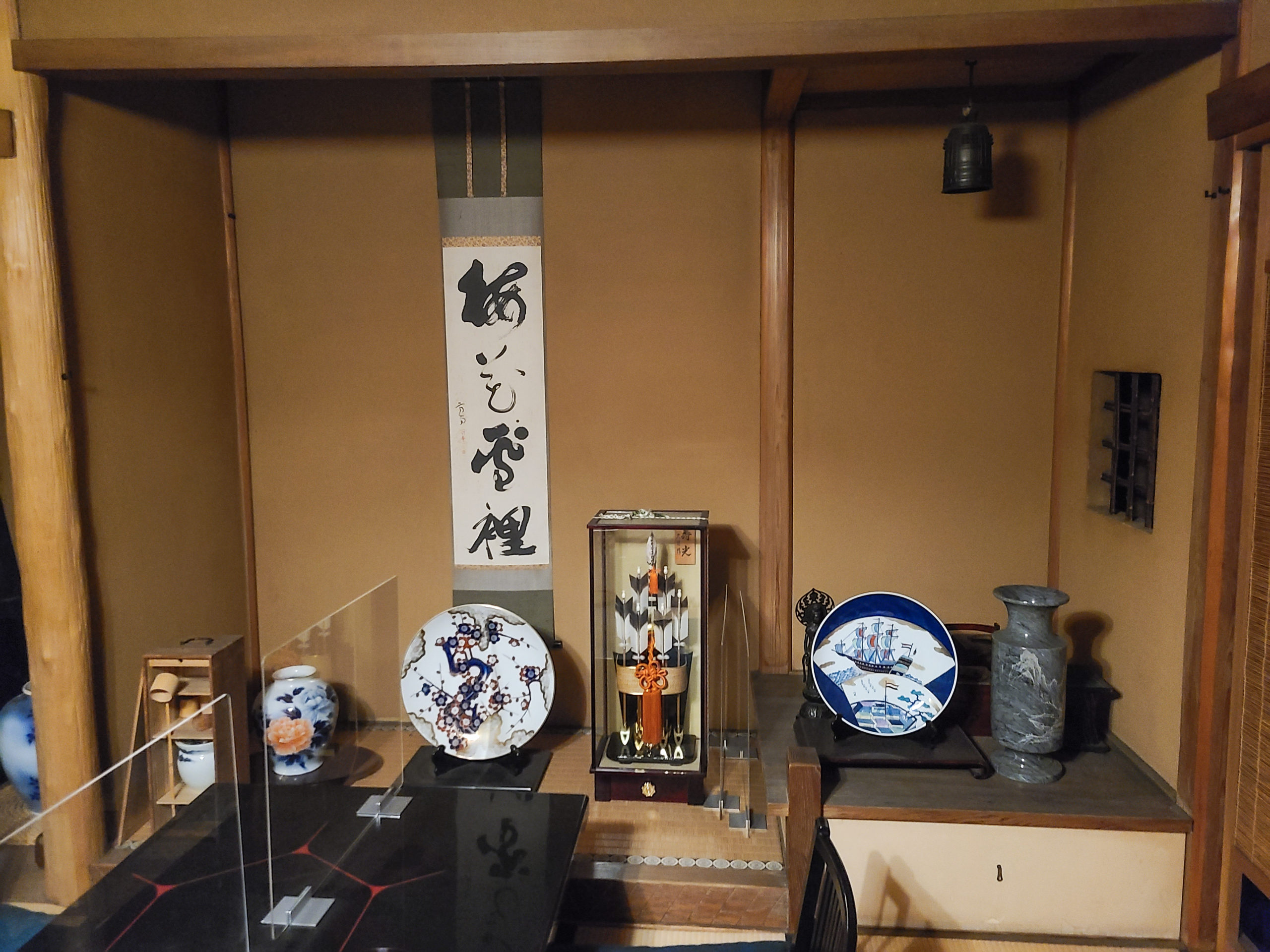 The tokonoma (alcove) with hanging scroll and various antiques
