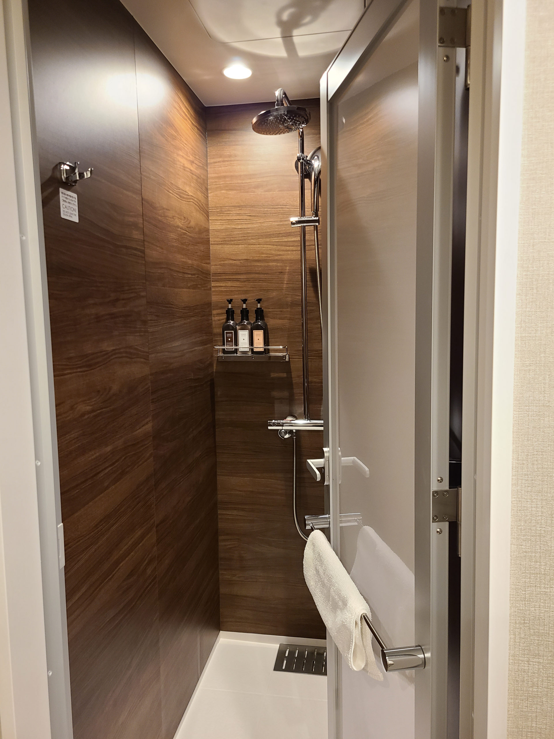 This room has a separate shower, toilet, and sink