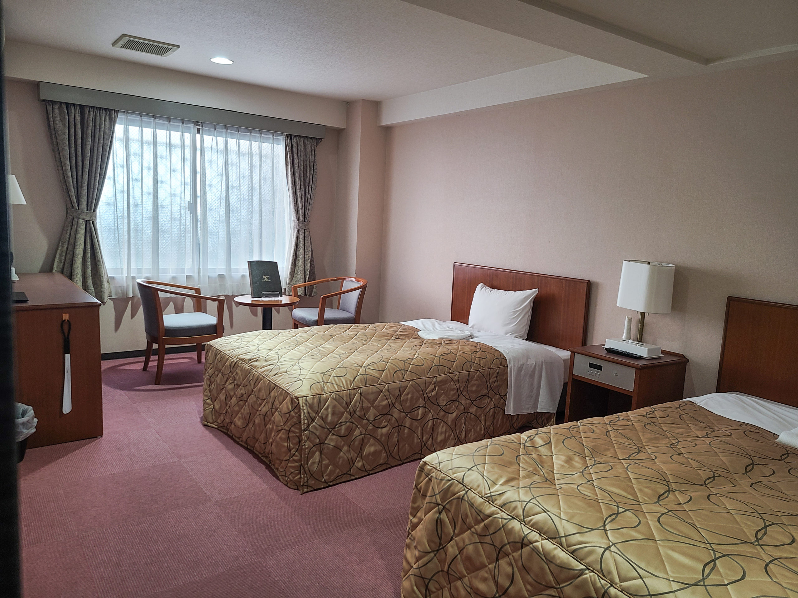 The rooms are clean and pleasant, available in single, semi-double, double, twin, and triple sizes. All rooms have a non-smoking policy which is strictly enforced. While only 5 minutes away from the station, the hotel is not on the main road so rooms are relatively quiet. 