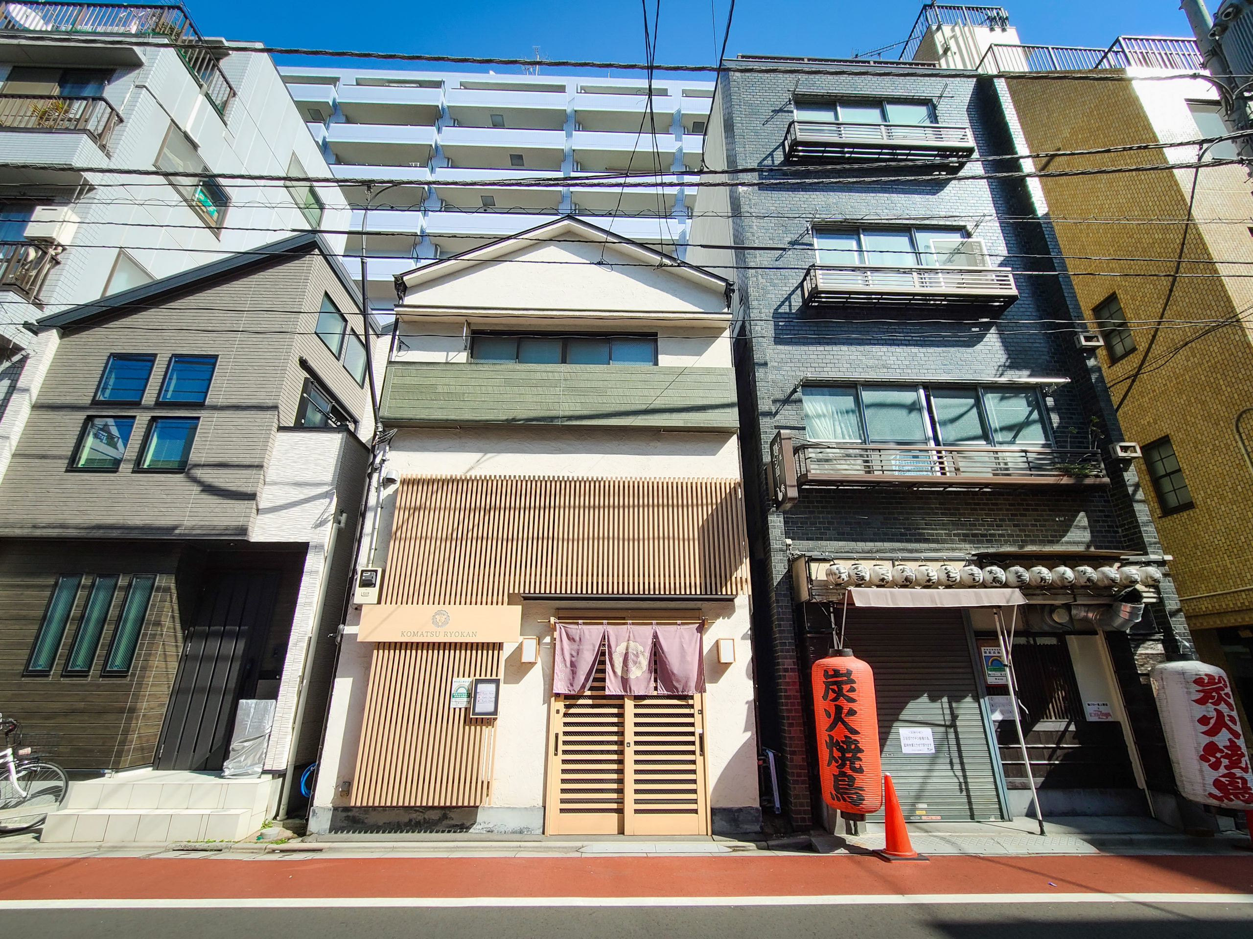 I reach the ryokan, nestled in between a regular house and a traditional-looking yakitori restaurant, complete with red chōchin lantern in front.