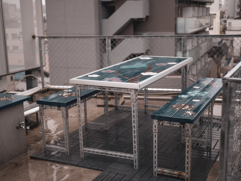 Our last stop, which was not very long due to the rainy weather, was to the roof. When sunny, however, the roof area has an area with a bench where guests can chat, enjoy some beer, or even have a smoke.