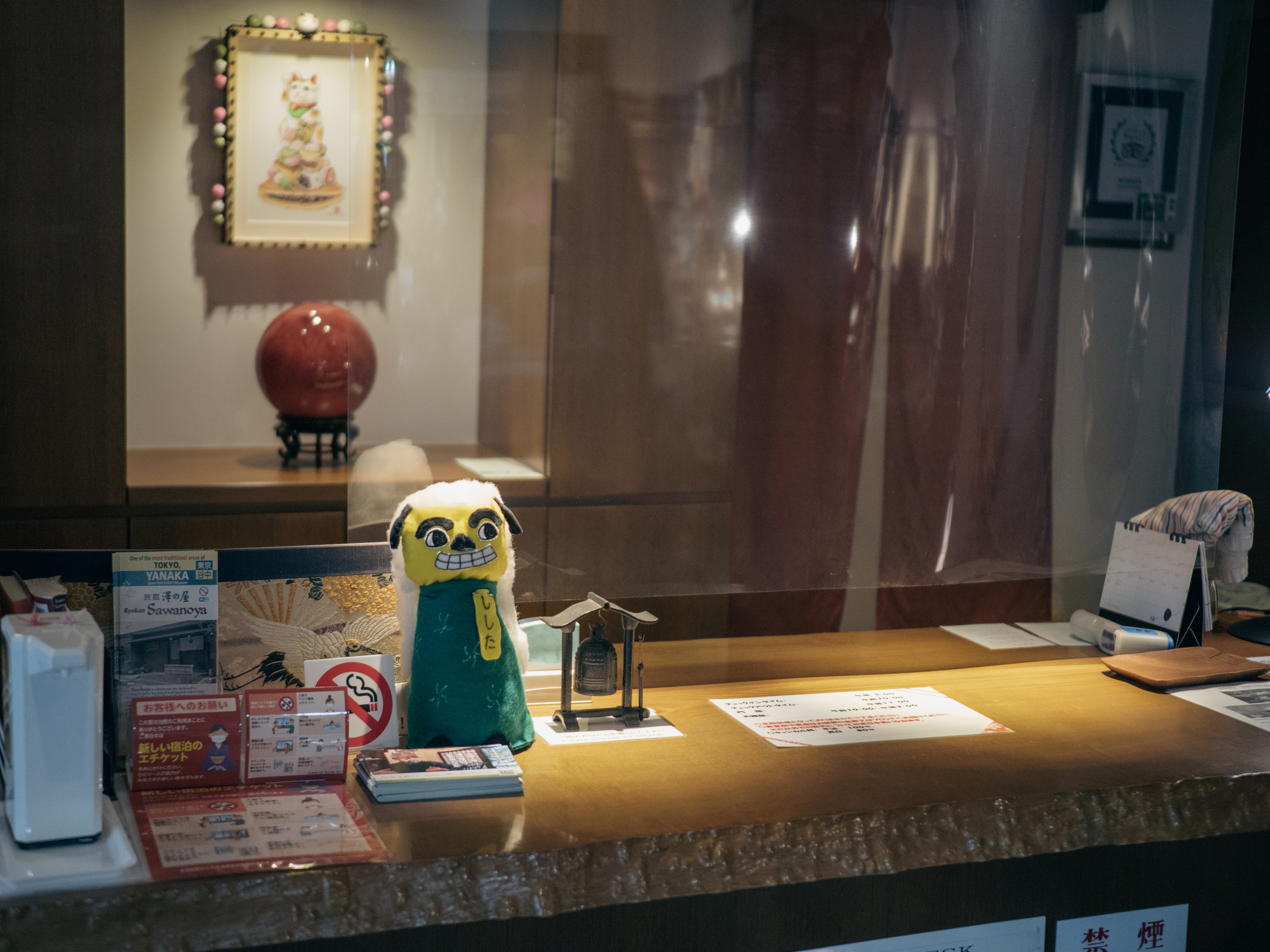 A small plush toy sits on the counter