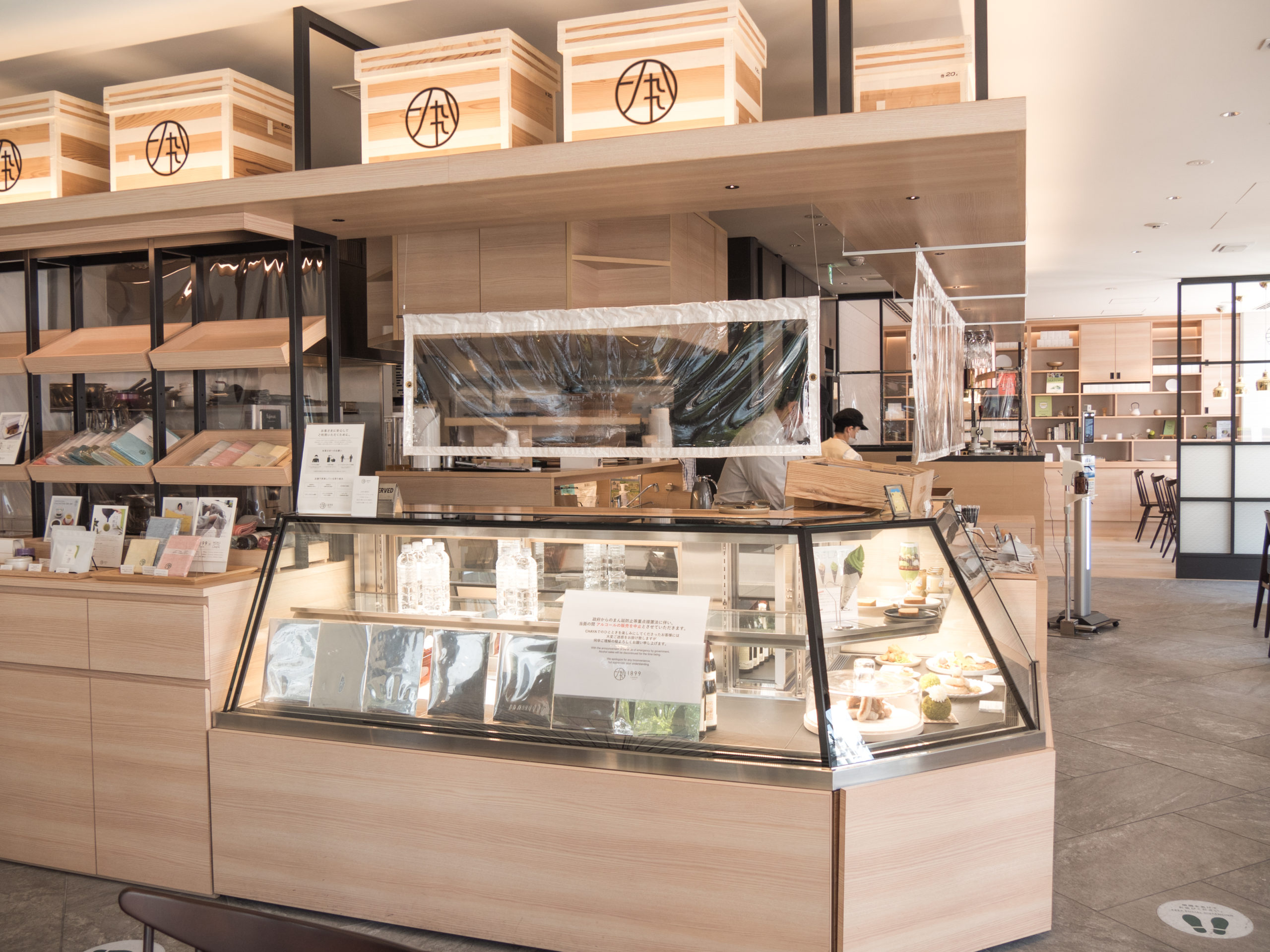 The boxes above the counter are also part of the tea-themed design, made to resemble those that are traditionally used for storing and transporting tea