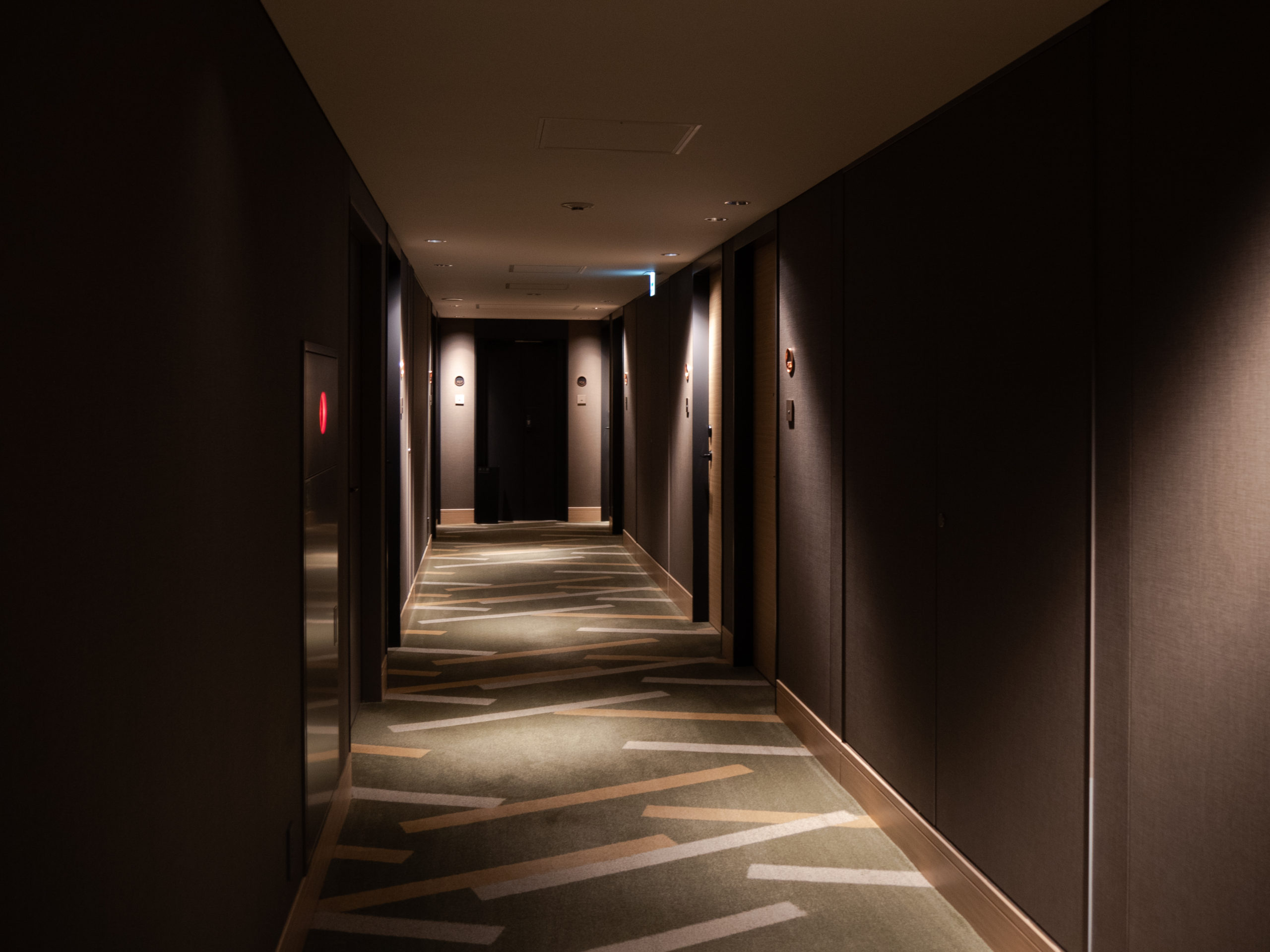 The pattern on the hallway carpet is a reoccurring motif throughout the hotel The fragrance of incense is soothing, and the moody lighting allows me to feel like I really have stepped out of the everyday into a special dimension, where time is irrelevant. 