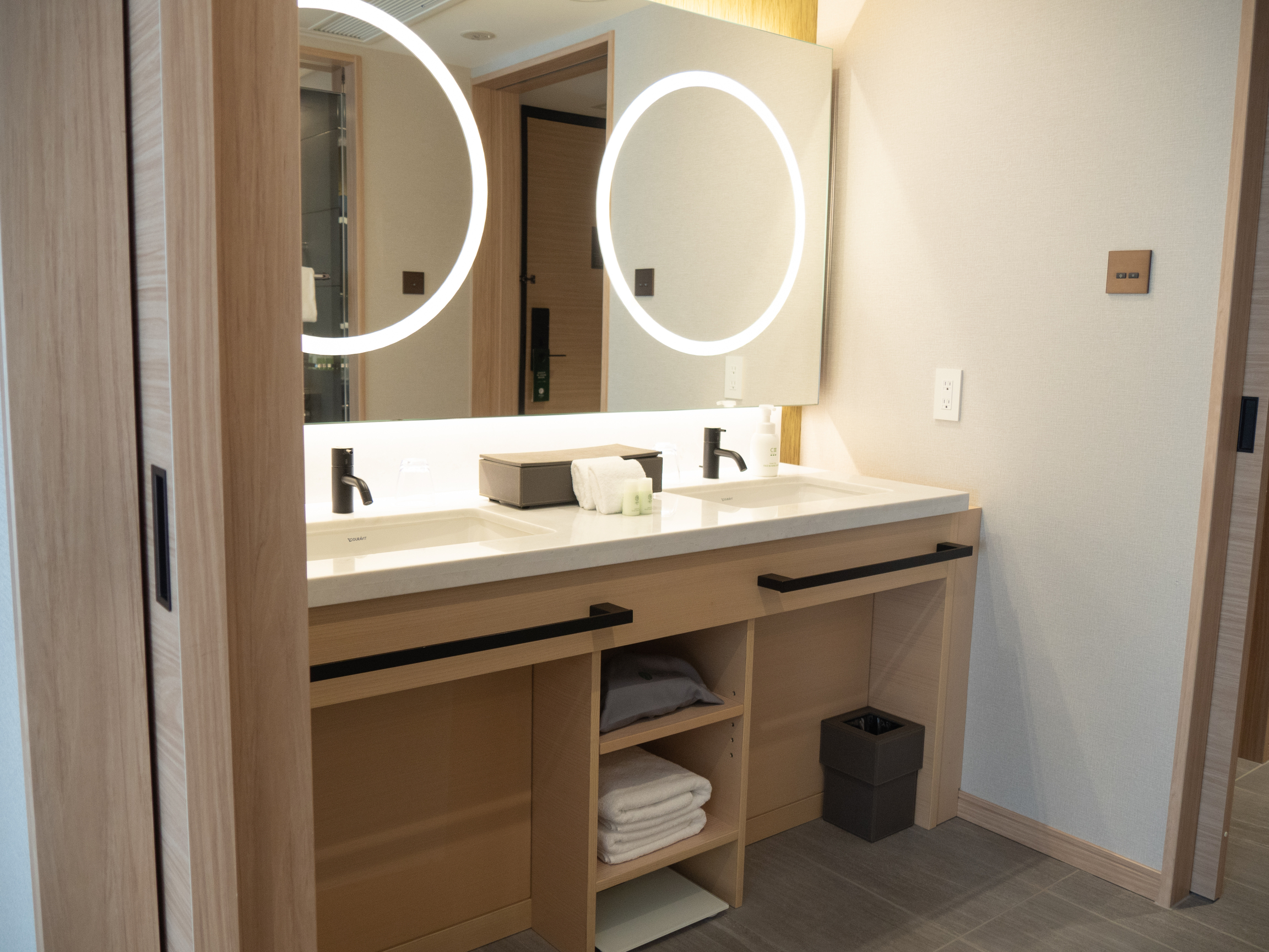 There’s plenty of room to get ready with this large mirror and two sinks