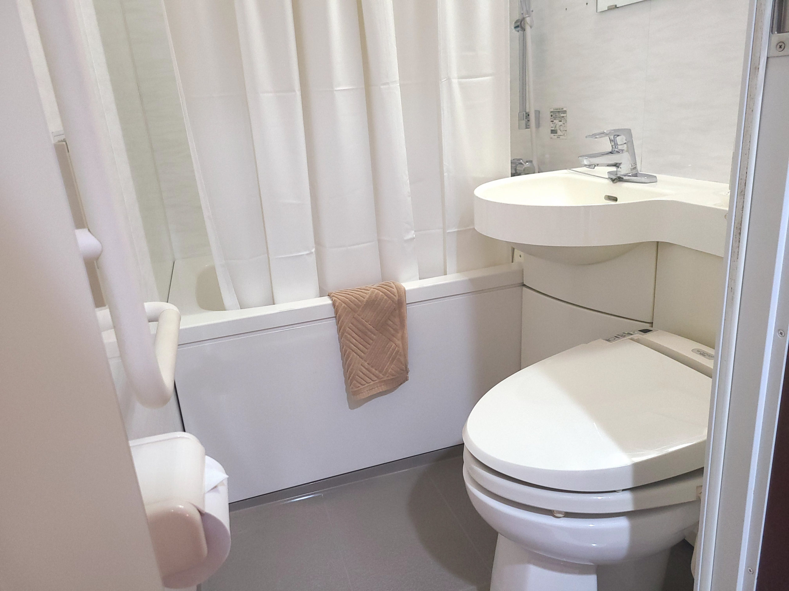 The unit bathroom features a high-tech washlet toilet